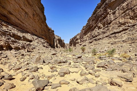 Open rocky canyon landscape with clear blue sky, rocky canyon in the desert landscape of the Sahara