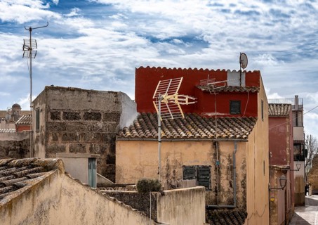 View of Mediterranean houses, roofs and courtyards from the town wall, Alcudia, Majorca, Spain