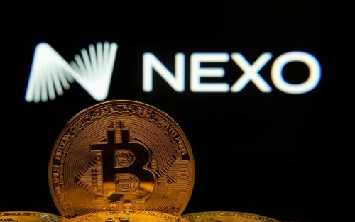 Dhaka, Bangladesh- 06 Sep 2025: Close-up of Bitcoin coins with the Nexo logo visible on a screen in