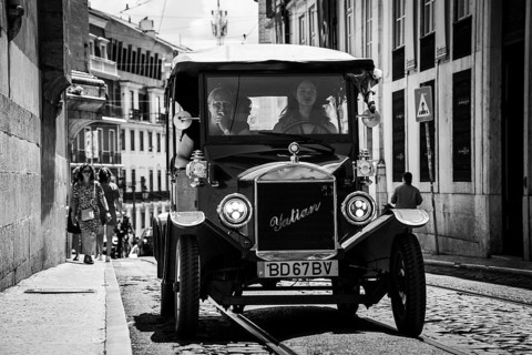 LISBON, PORTUGAL - MAY 19, 2025: Old touristic car at the street of Lisbon