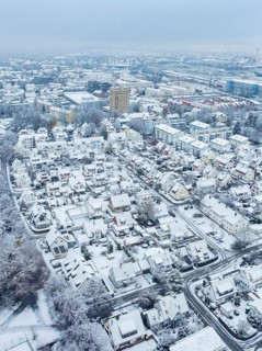 Snowy city view from the air with focus on houses and streets, Sindelfingen, Germany