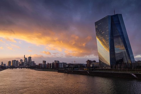 Clouds pass over the European Central Bank (ECB) and the Frankfurt banking skyline in the evening,