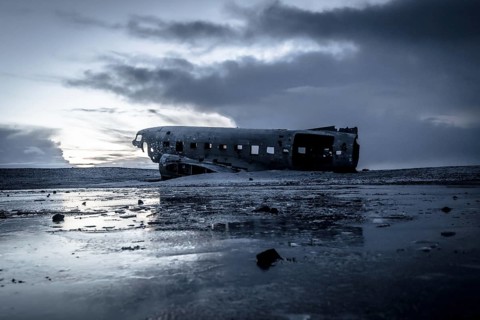 Plane wreck, crahsed plane on frozen Solheimasandur beach in winter with snow in Iceland