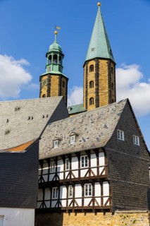 Artful half-timbered houses in the old town with a view of the Goslar Market Church of St Cosmas