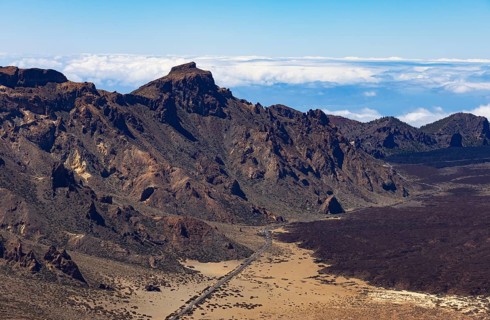 Mountain hiking, view from the summit of Montana Guajara onto the road through the Teide National