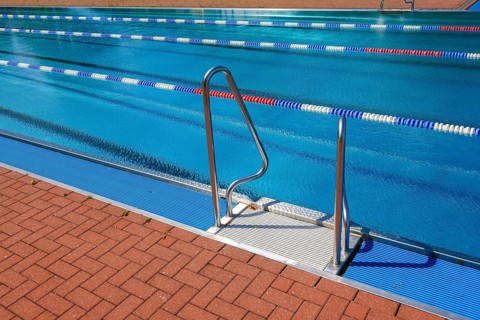 Hagen, North Rhine-Westphalia, Germany - Ladder at the edge of the swimming pool in the Hengstey