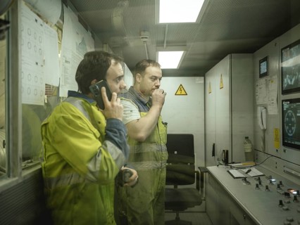 Workers in a control room of the double shield tunnel boring machine in section H53 of the Brenner
