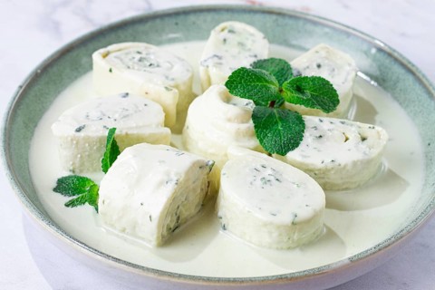 Gebjalia, Megrelian dish, cold appetizer of cheese with mint, Georgian traditional cuisine,