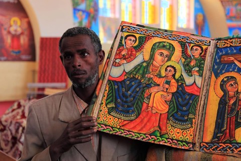 Tigray region, Axum, Aksum, St Mary's Cathedral, Maryam Tsion, inside, church servant shows old