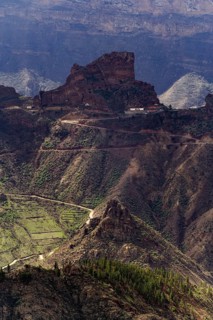A breathtaking view of the iconic Roque Bentayga rising majestically above the rugged terrain of