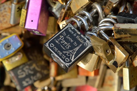 Love padlocks attached to the railing of the Pont de l'Archevêché bridge, Paris, France