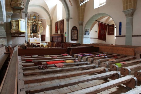 Pews, interior of the fortified church in Honigberg, Harman, Burzenland in Transylvania, Romania