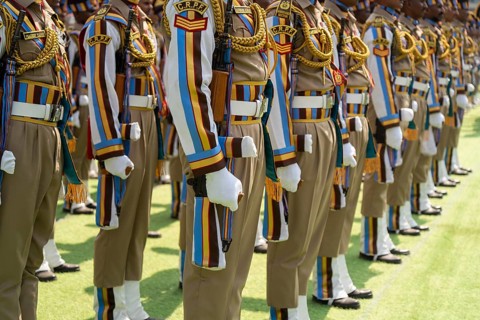 Central Reserve Police Force (CRPF) personnel wearing ceremonial headgear stand in formation during