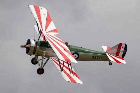 Avro 621 Tutor biplane aircraft in RAF Royal air force colours flying, England, United Kingdom