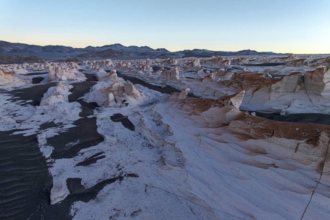The expansive white pumice field in Catamarca, Argentina, showcases incredible rock formations and