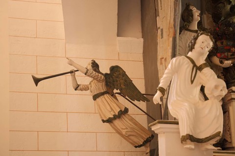 Angel blowing trombones, sculpture, interior view, Romanesque collegiate church of St. Anastasius