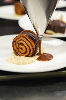 A culinary fusion combining cinnamon roll and slow-cooked oxtail in its own juices, enhanced by