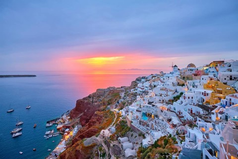 Famous greek iconic selfie spot tourist destination Oia village with traditional white houses and