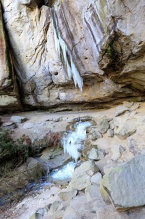 Frozen waterfall with icicles in the Gautschgrotte, Hohnstein, Saxony, Germany