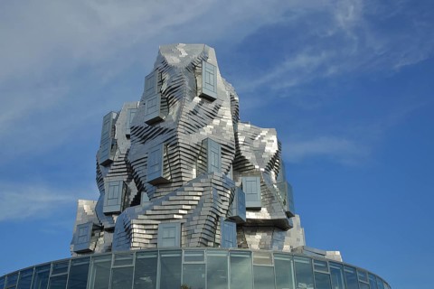 Luma 56m tour by architect Frank Gehry 2021, modern building, silver roof and bizarre spire,