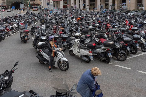 Large car park for scooters in the city, Genoa, Italy