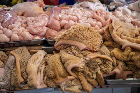 Butcher's shop with fresh meat and offal, market at Osh Bazaar, Bishkek, Kyrgyzstan