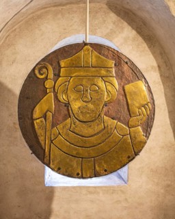 Fire-gilded Romanesque copper disc with the relief portrait of Saint Conrad of Constance,