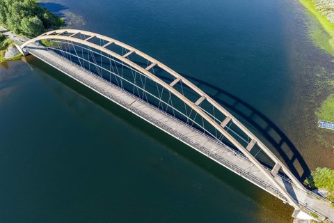 Decommisssioned arched bridge over the Kalix river, pedestrian and cycle path, Lappeasuando, Sweden