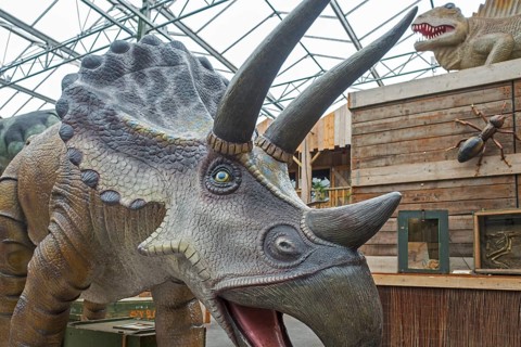 Giant dinosaur replicas on display at the Berkenhof Tropical Zoo, amusement and animal park near