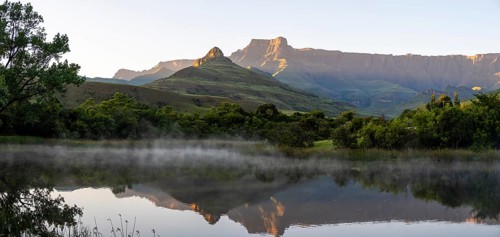 Sunrise, amphitheatre with reflection in the lake, Royal Natal National Park, Drakensberg Mountains