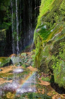 Splashing water of the Amsel Falls, a waterfall near the village of Rathen in Saxon Switzerland