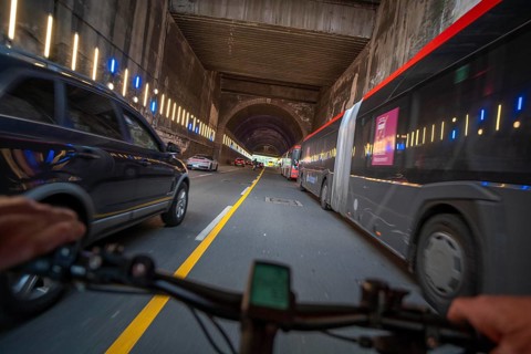 Cycling in the city, city centre road, no cycle path, tunnel, two-lane traffic in both directions,