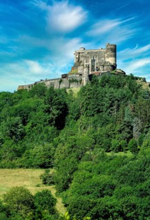 Murol castle built on a basalt promontory in the 13th century. Auvergne Volcanoes Natural Park. Puy