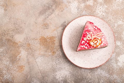Chocolate cake on brown concrete background, top view, flat lay, copy space