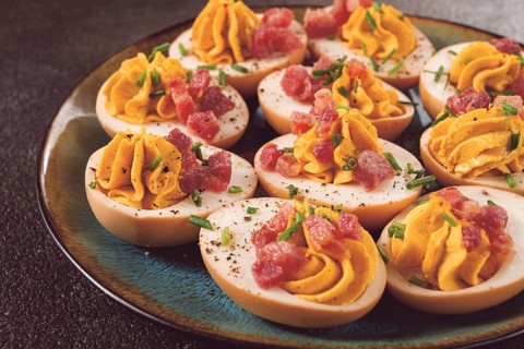 Spicy, stuffed ramen eggs, with bacon and green onions, homemade, no people