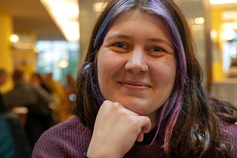 Portrait of a smiling young woman with colourful dyed hair and nose piercing, Bavaria, Germany