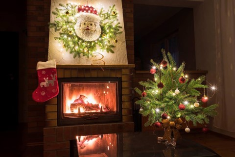 Christmas floral decoration in front of firepace