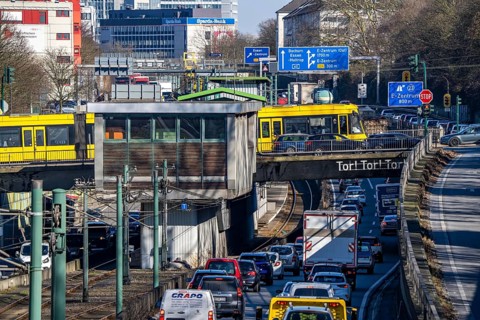 Motorway A40, Ruhr expressway, heavy traffic jam, rush hour, city passage in Essen, skyline of the
