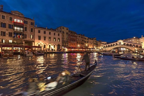Grand Canal with Rialto Bridge in the evening, gondola in front, Venice, Veneto, Italy