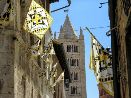 Bell tower, campanile of San Cerbone Cathedral, flags on the Palazzetto delle Armi, Museum of Art,