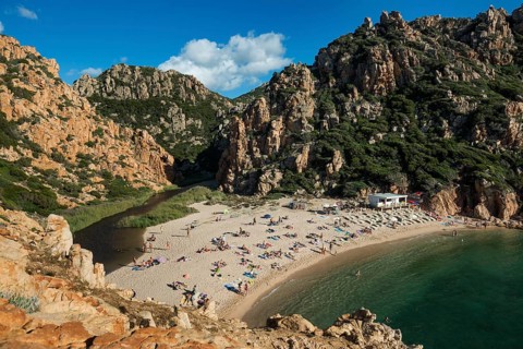 Red rocks and picturesque beach, Spiaggia di Cala li Cossi, Costa Paradiso, Sardinia, Italy
