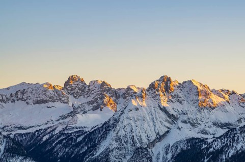 Beautiful landscape of the Mountain silhouettes of the Sexten Dolomites on a sunny winter day,