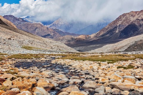 Mountain stream in Himalayas near Kardung La pass. Ladakh, India
