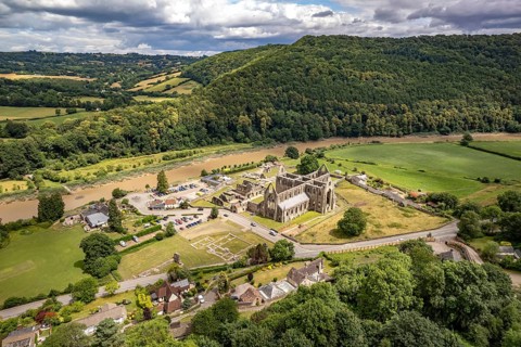 The ruins of Tintern Abbey and the Wye Valley landscape seen from the air, Tintern, Monmouth,