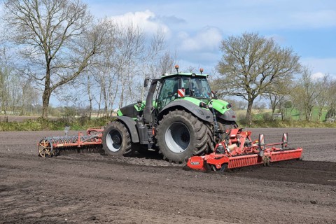 Tractor with harrows, disc harrows during tillage