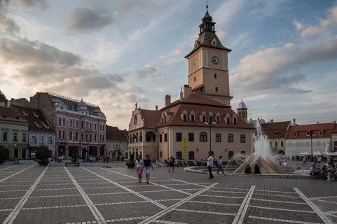 BRASOV, ROMANIA - JUNE 26, 2024: The town hall building and the market square