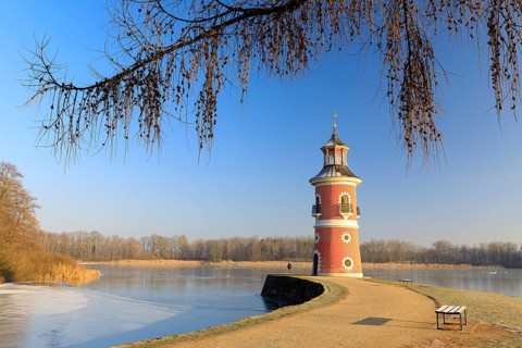 Pier with lighthouse on the large pond near the Fasanenschlößchen, Moritzburg, Saxony, Germany