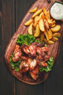 Fried chicken wings, with potatoes, and spices, homemade, fast food, no people