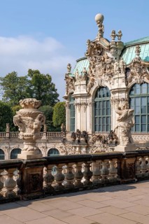 A detailed view of the ornate Baroque architecture of the Palace Zwinger in Dresden, Germany,