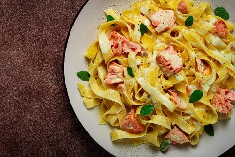Tagliatelle pasta, in cream sauce with salmon, homemade, no people